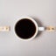 cup of coffee switching on. top view, flat lay