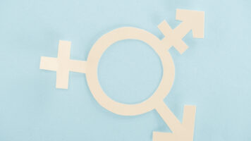 white paper gender sign on blue background, lgbt concept